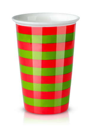 Red and green striped cup without handle isolated on white backgroundの写真素材