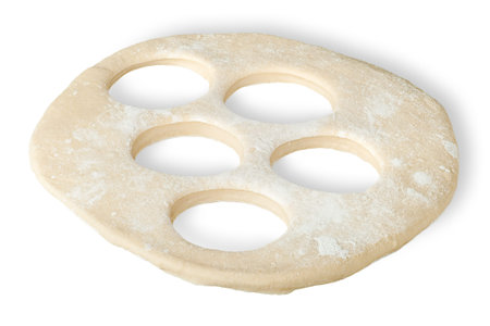 Roll dough with hole cut out isolated on white backgroundの写真素材