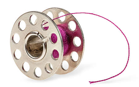 Metal spool with burgundy thread isolated on white backgroundの写真素材