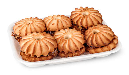 Shortbread biscuits with filling in plastic tray isolated on white backgroundの写真素材