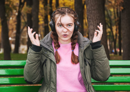 Surprised young girl with headphones