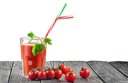 Cherry tomatoes with glass of tomato juiceの写真素材