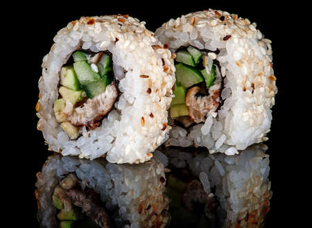 Closeup two sushi rolls californiaの写真素材