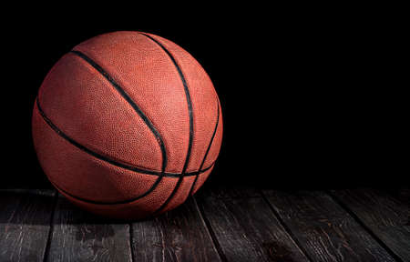 Basketball ball on a wooden floorの写真素材