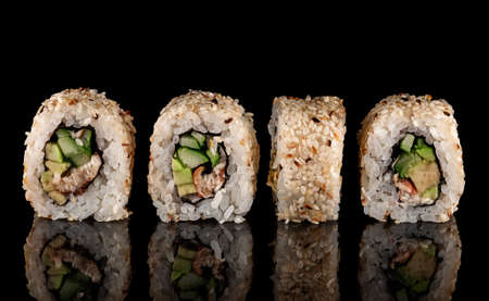 Several sushi california rolls in a rowの写真素材