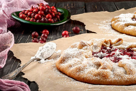 Open pies with gooseberriesの写真素材