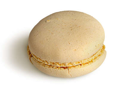 One yellow macaroon angled view isolated on a white backgroundの写真素材