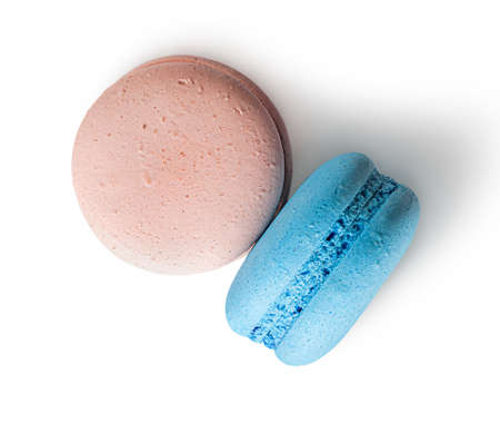 Two macaroon beige blue top view on white backgroundの写真素材