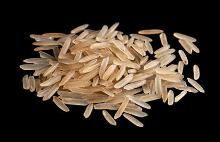 Small pile of long rice on black backgroundの写真素材