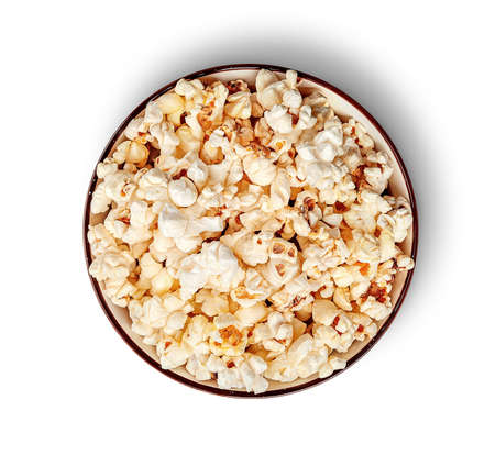 Popcorn in bowl top view isolated on white backgroundの写真素材