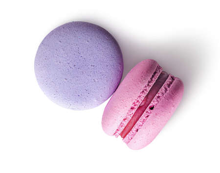 Two macaroon purple pink top view on white backgroundの写真素材
