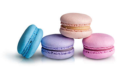 Three macaroon pyramid and one near on white backgroundの写真素材