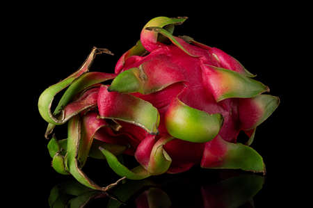 Dragon fruit horizontally rotated on a black backgroundの写真素材