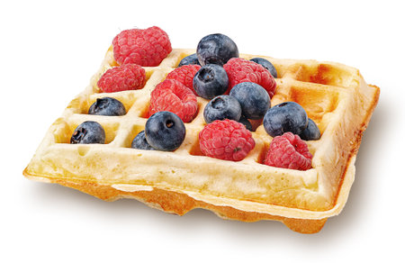 French waffle with berries isolated on whiteの写真素材