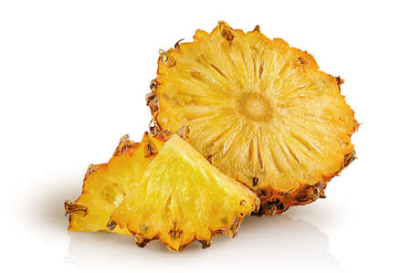 Half pineapple and slices isolated on white backgroundの写真素材