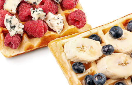 French waffles with berries, bananas and dorblu cheese isolated on white backgroundの写真素材