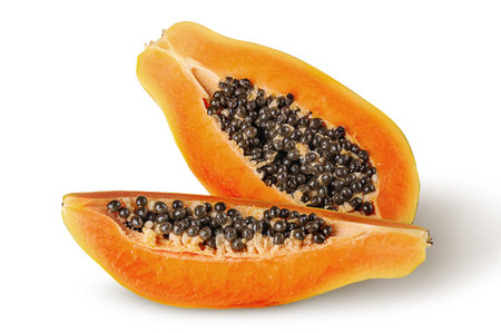 Half and quarter ripe papaya top wiev isolated on white backgroundの写真素材
