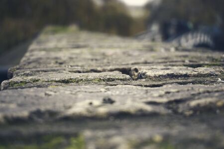 View On Top of Bricks and Stones Bridge with mossの写真素材