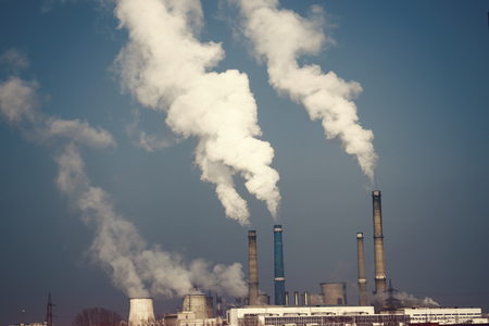 Industrial chimney urban scenery power plant pollution steam landscapeの写真素材
