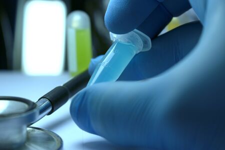 Gloved Hand Holding Research Vial, Stem Cell Research Substance in Vialの写真素材