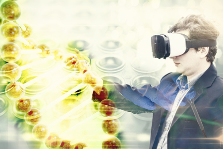 double exposure of doctor researcher medic with VR glasses analyzing DNA helix simulating cure research techniqueの写真素材