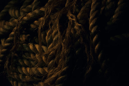 Low light vintage street scenery with big rope, barrels, wooden doors and vintage pavement , old docks sceneryの写真素材