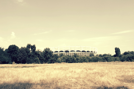 Football Stadium seen from abandoned fieldの写真素材