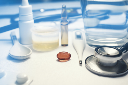 Influenza virus treatment with pills cough syrup effervescent pills nose drops vialsの写真素材