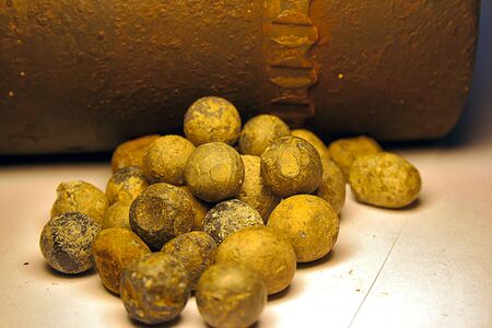 Shrapnel balls near a World War I Shellの写真素材