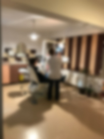 Blurred Dentist cabinet with dentist and patientの写真素材