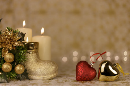 Greeting Christmas card with burning candles and ornamentsの写真素材