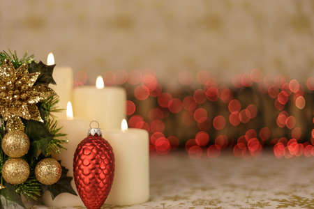 Greeting Christmas card with burning candles and ornamentsの写真素材