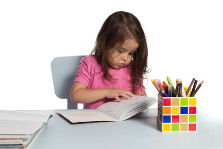 Preschool girl reading.の写真素材