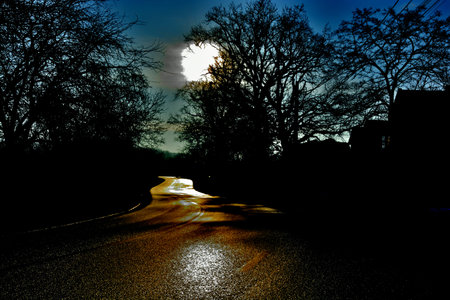 Winding road in the night uncertaintyの写真素材