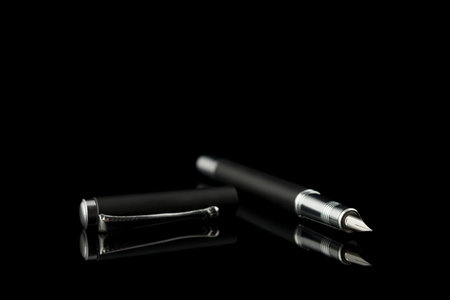 black office pen with cap and reflectionの写真素材