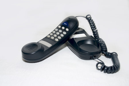 Black desk phone close-up