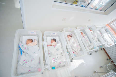 Sleeping sweet babies in a white nursery hospital wide angleのeditorial素材