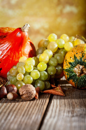 Autumn fruit and vegetable on wooden tableの写真素材