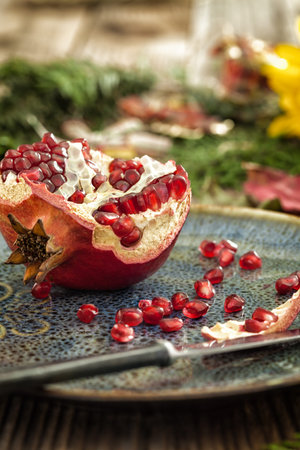Pomegranate on rustic wooden tableの写真素材