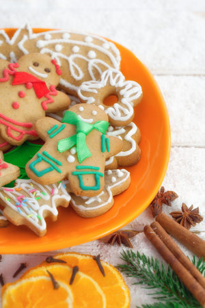 Christmas gingerbread cookie couple on white wooden board with copy space