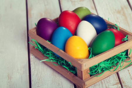 Easter eggs on white wooden backgroundの写真素材