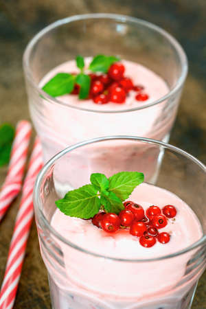 Smoothie on wooden board - close upの写真素材