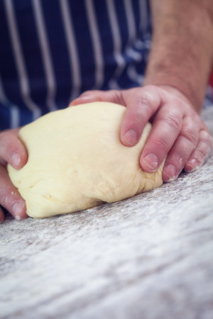 Baker kneading dough