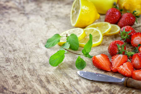 Detox fruit infused water - ingredients on wooden backgroundの写真素材