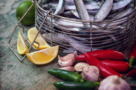 Fresh anchovy with garlic, lemon and jalapeno peppersの写真素材