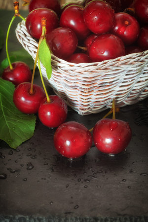 Ripe Sweet Cherries in Basketの写真素材