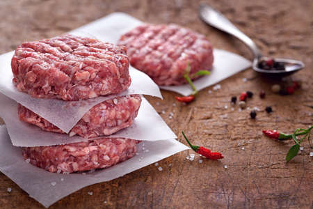 Raw Ground beef meat Burger pattiesの写真素材