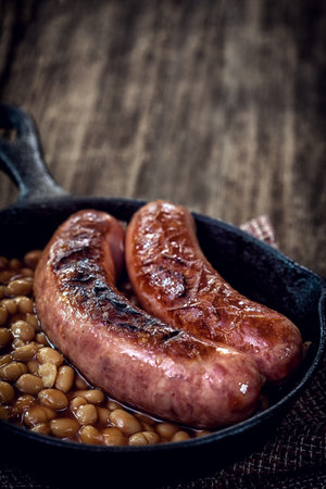 Grilled sausages with beansの写真素材