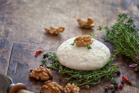 Goat cheese with thyme and nutsの写真素材