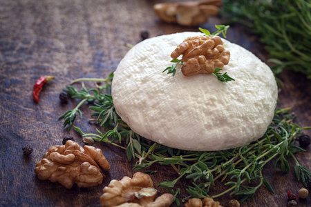 Goat cheese with thyme and nutsの写真素材